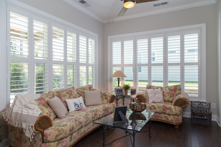 Traditional sunroom with faux wood shutters in Jacksonville.